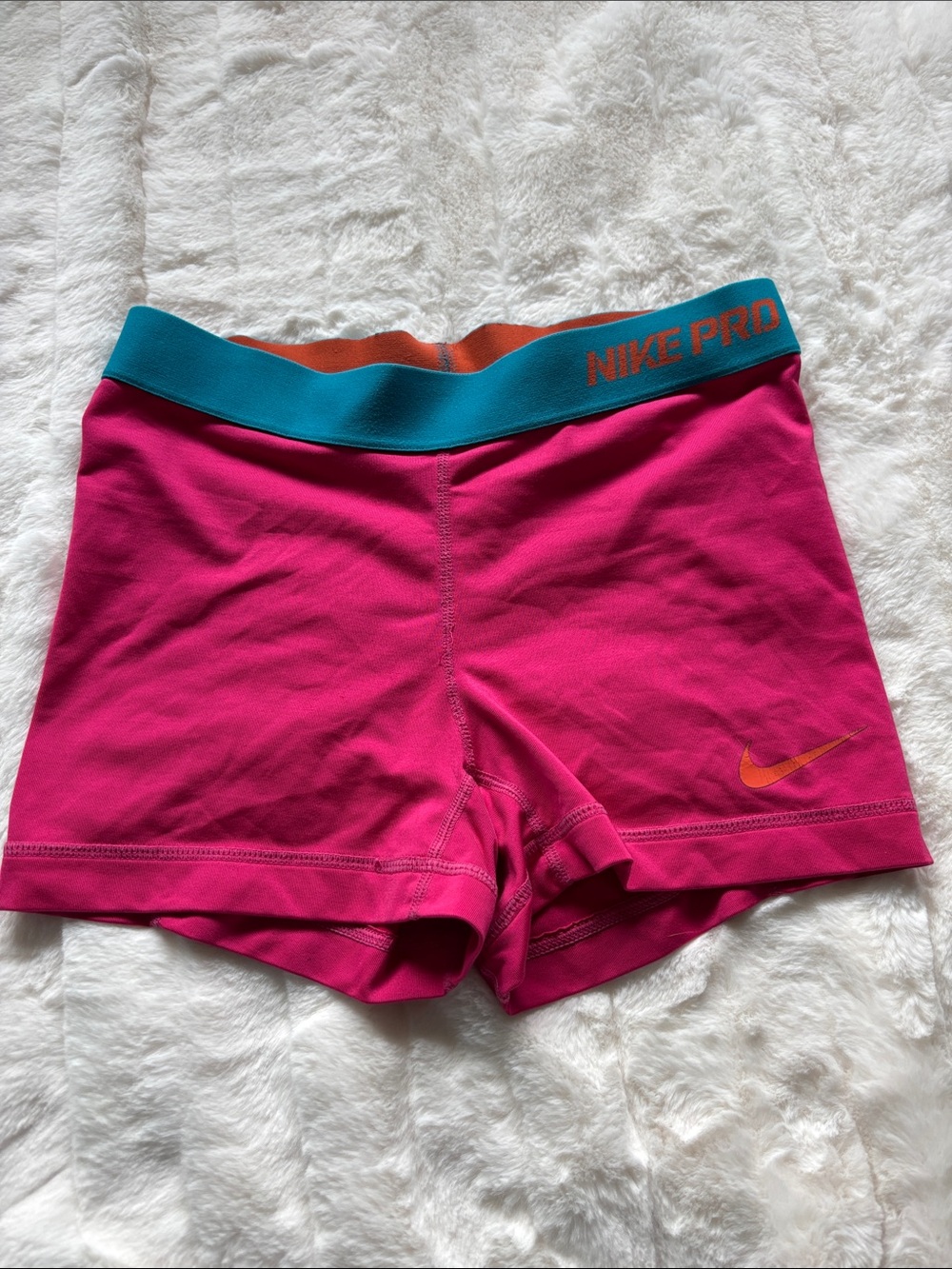 Nike Bright Pink Compression Shorts with Teal Waistband and Orange Accents